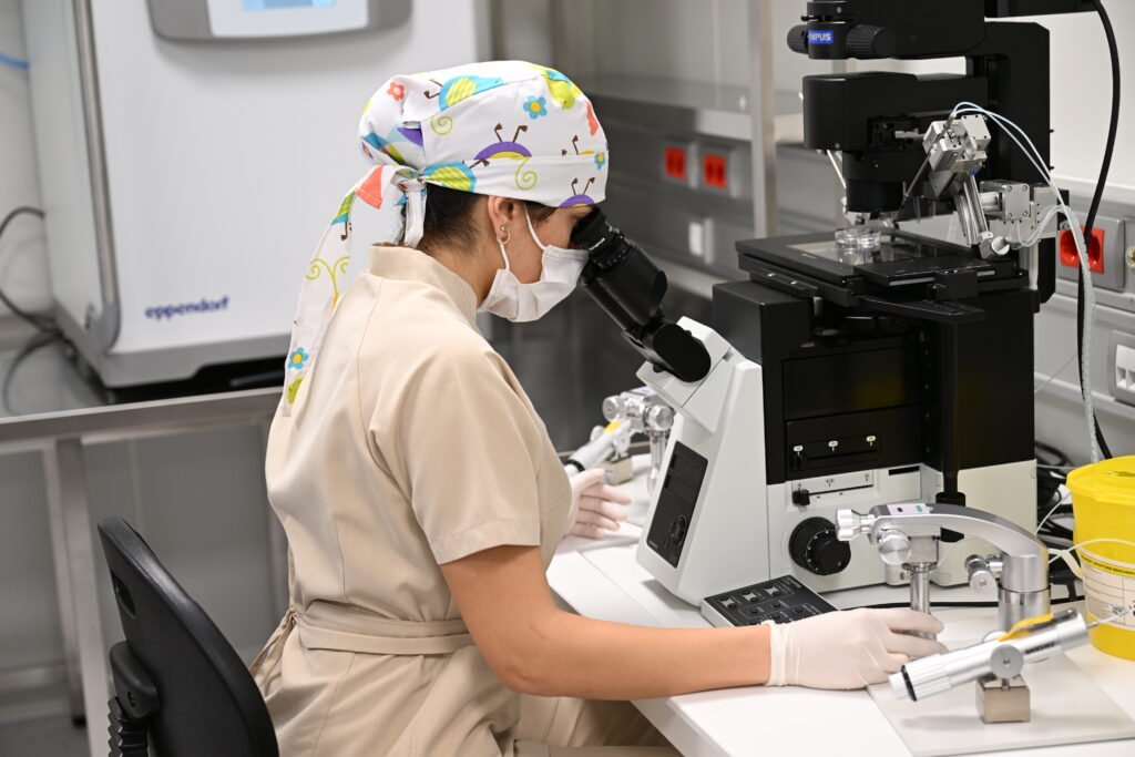 An employee at the "Gema" clinic uses a microscope in the in vitro fertilization laboratory-08