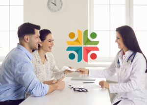 A happy couple at a consultation with a doctor for in vitro fertilization
