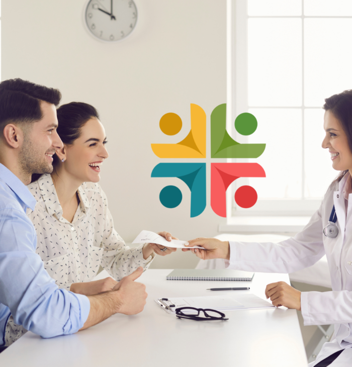 A happy couple at a consultation with a doctor for in vitro fertilization