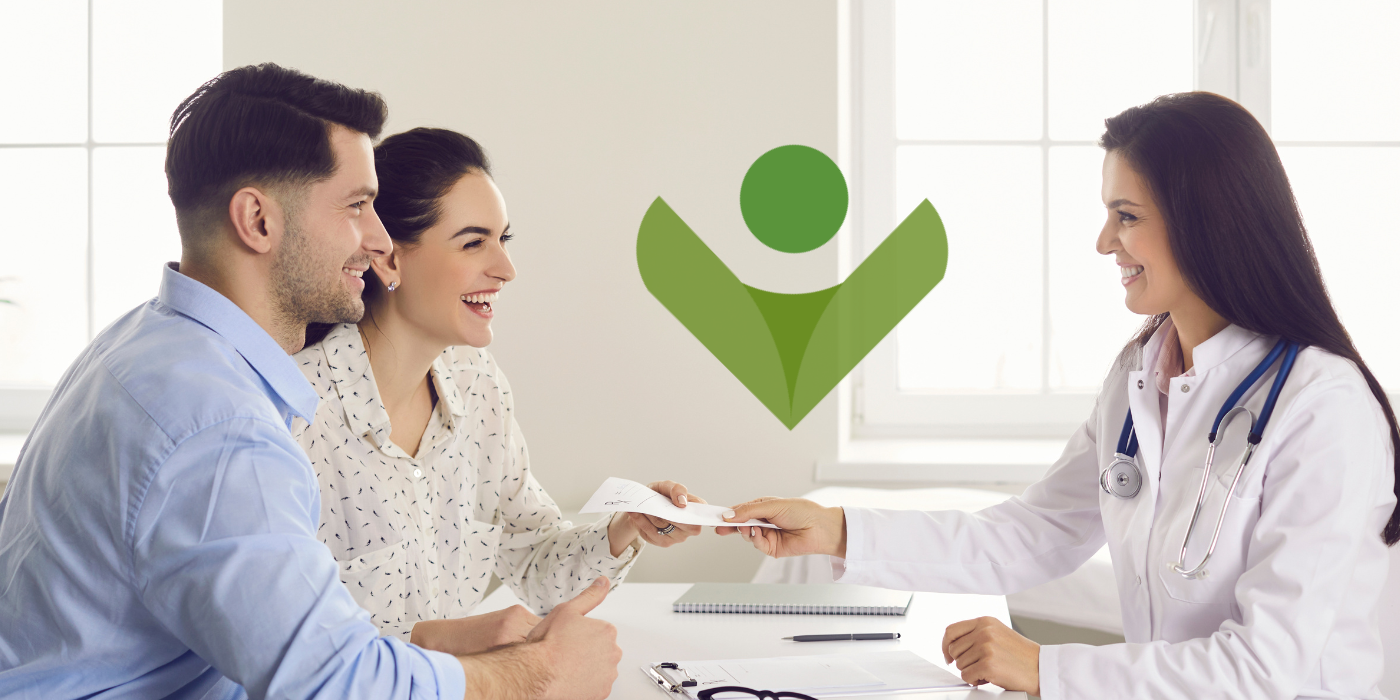 A happy couple at a consultation with a doctor for in vitro fertilization