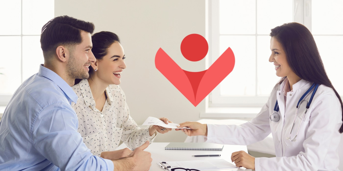 A happy couple at a consultation with a doctor for in vitro fertilization