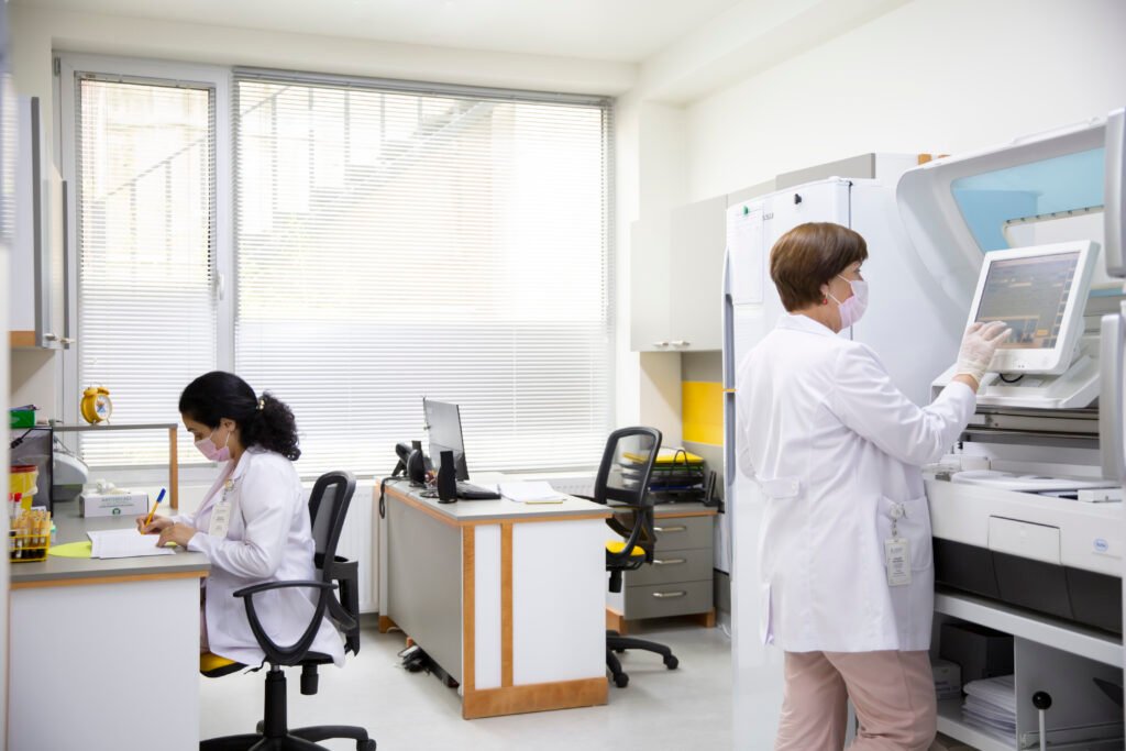 Medical laboratory technicians at the diagnostic lab of ReproART clinic, performing hormone analysis and preparing patients for IVF cycles.