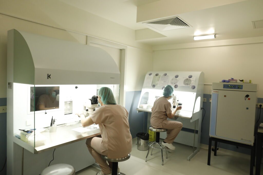 Embryologists at the ReproART clinic laboratory working on innovative IVF procedures in a sterile and professional environment.