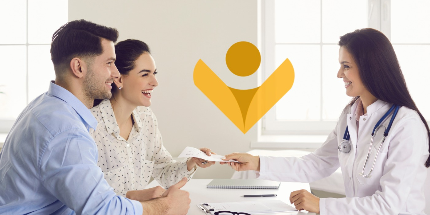 A happy couple at a consultation with a doctor for in vitro fertilization