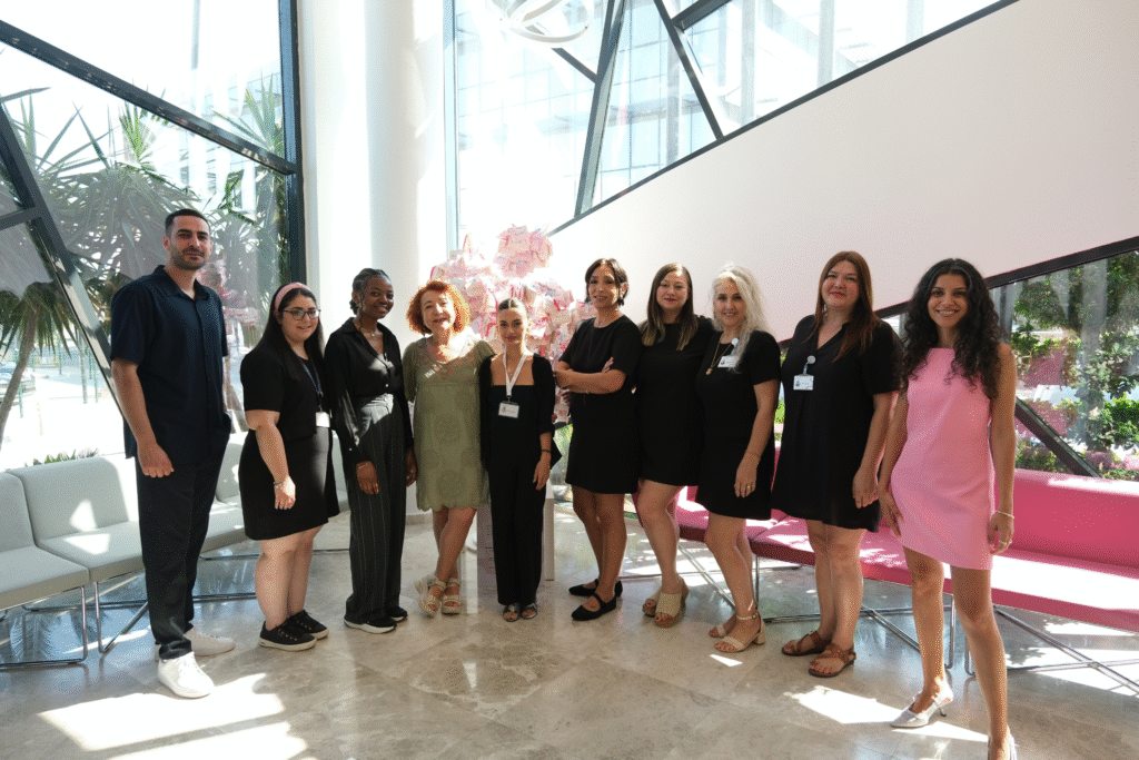 Group of British Cyprus IVF clinic employees standing inside the clinic, dedicated to in vitro fertilization and patient support.